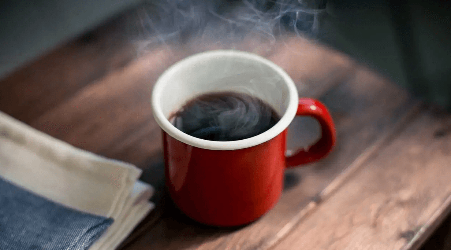 Hot cup of mushroom coffee in a red mug 