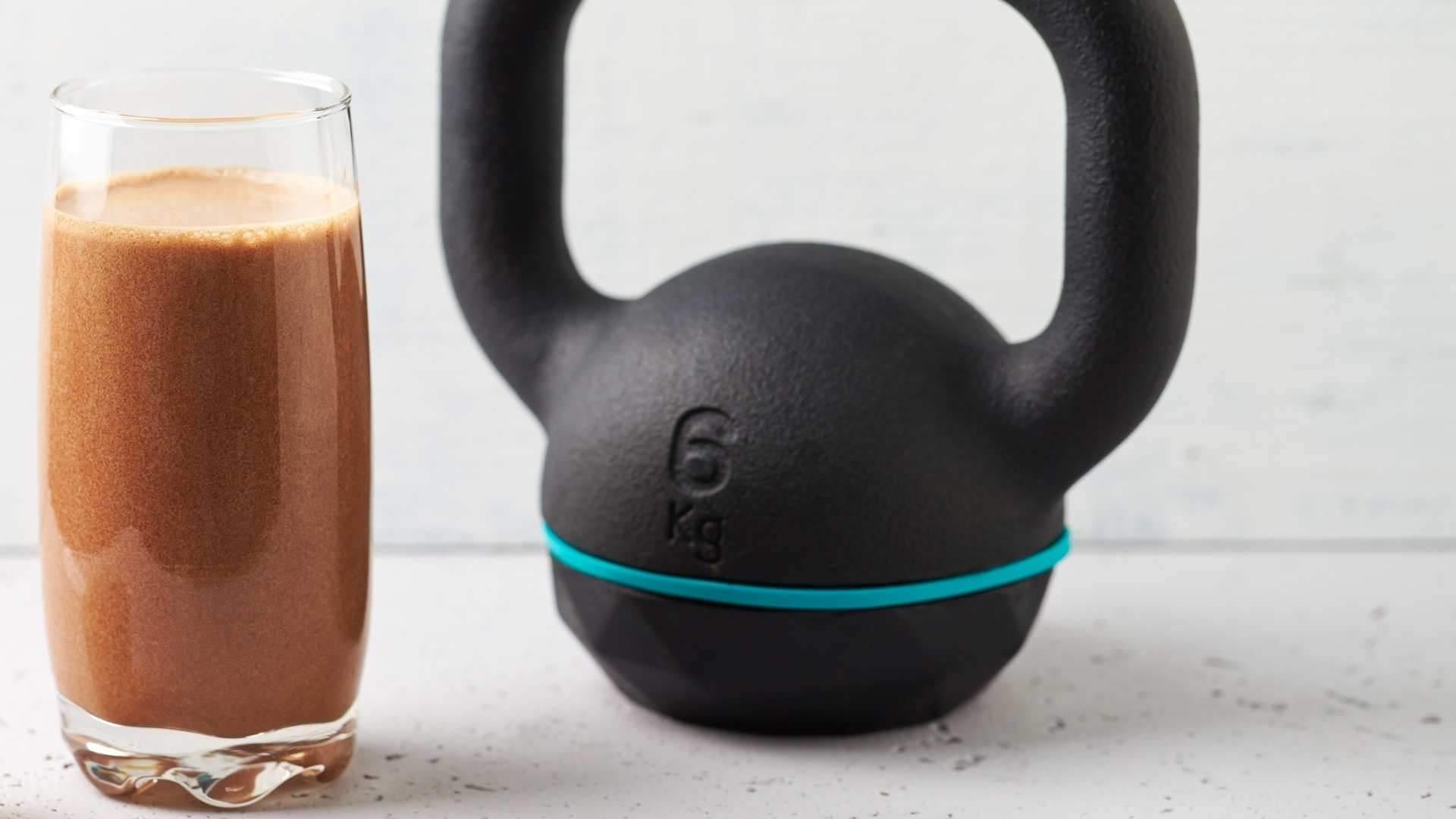 A delicious Plant Protein smoothie next to a kettle bell  