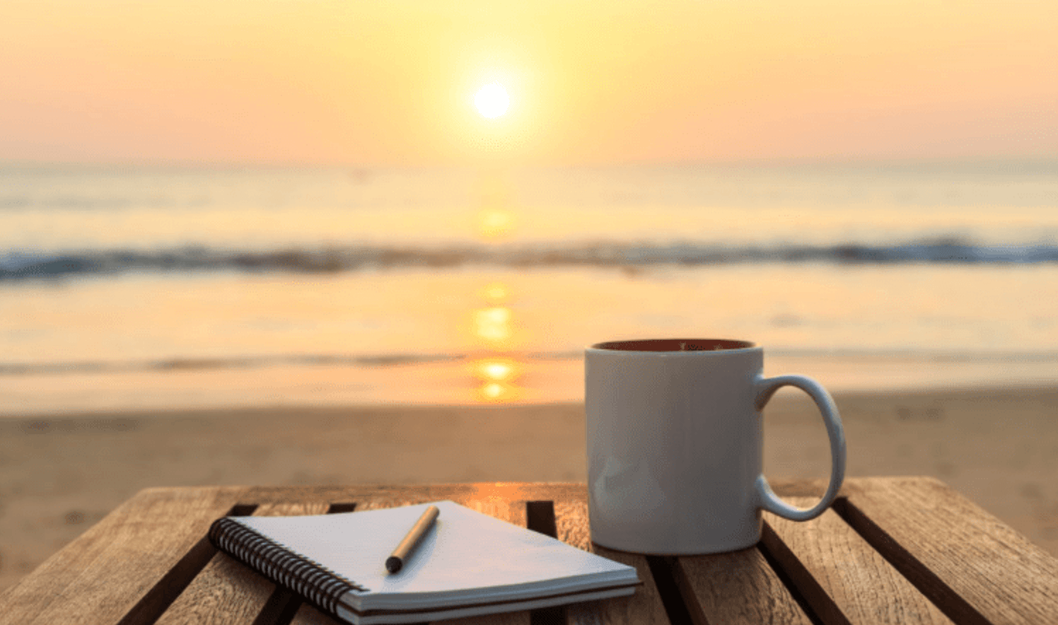 Does Mushroom Coffee Break My Fast? sunset with a coffee mug and note book 