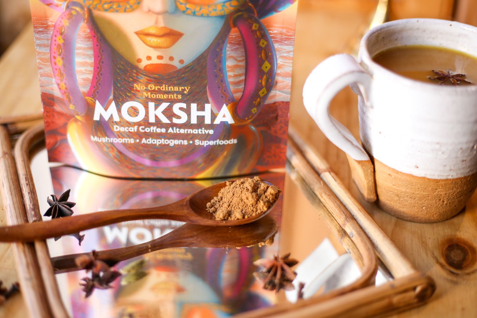 No Ordinary Moments Moksha Moksha product on a wooden spoon