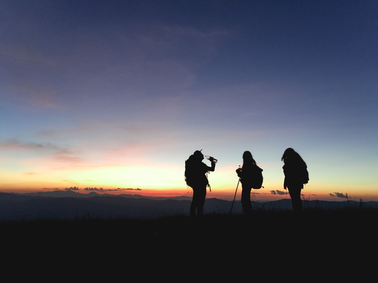 The Power of 1%, and how it can help you - No Ordinary Moments sunset with hikers