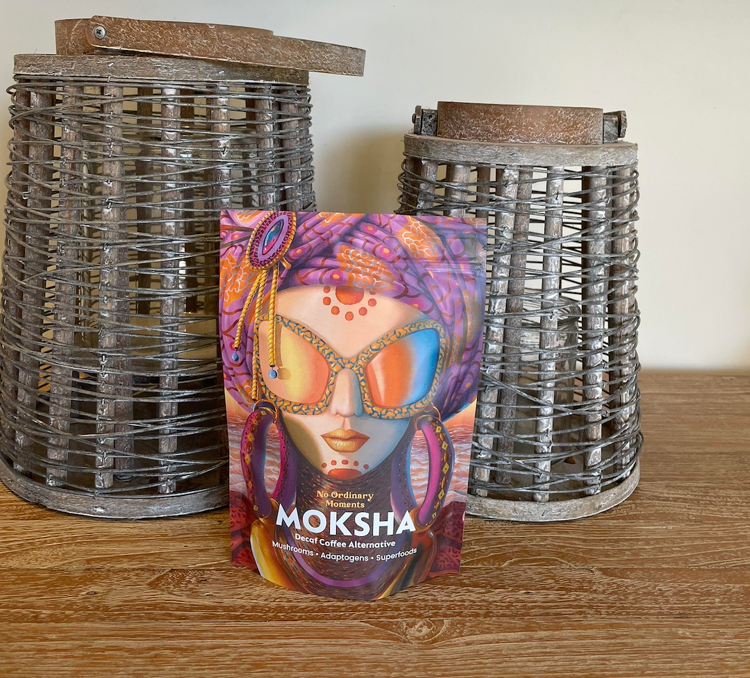 Moksha Coffee in front of wooden bowls 