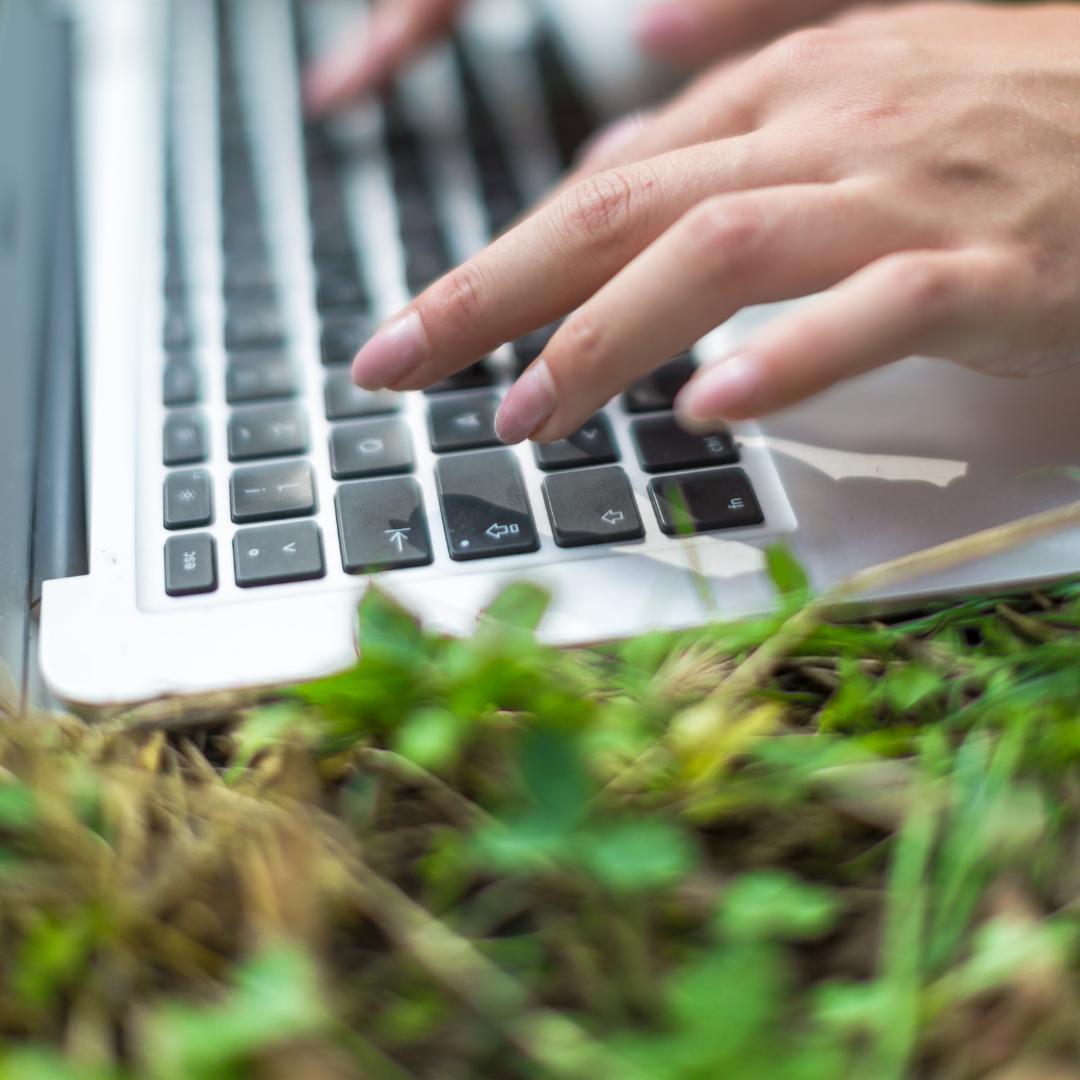 Natural energy and focus laptop on grass