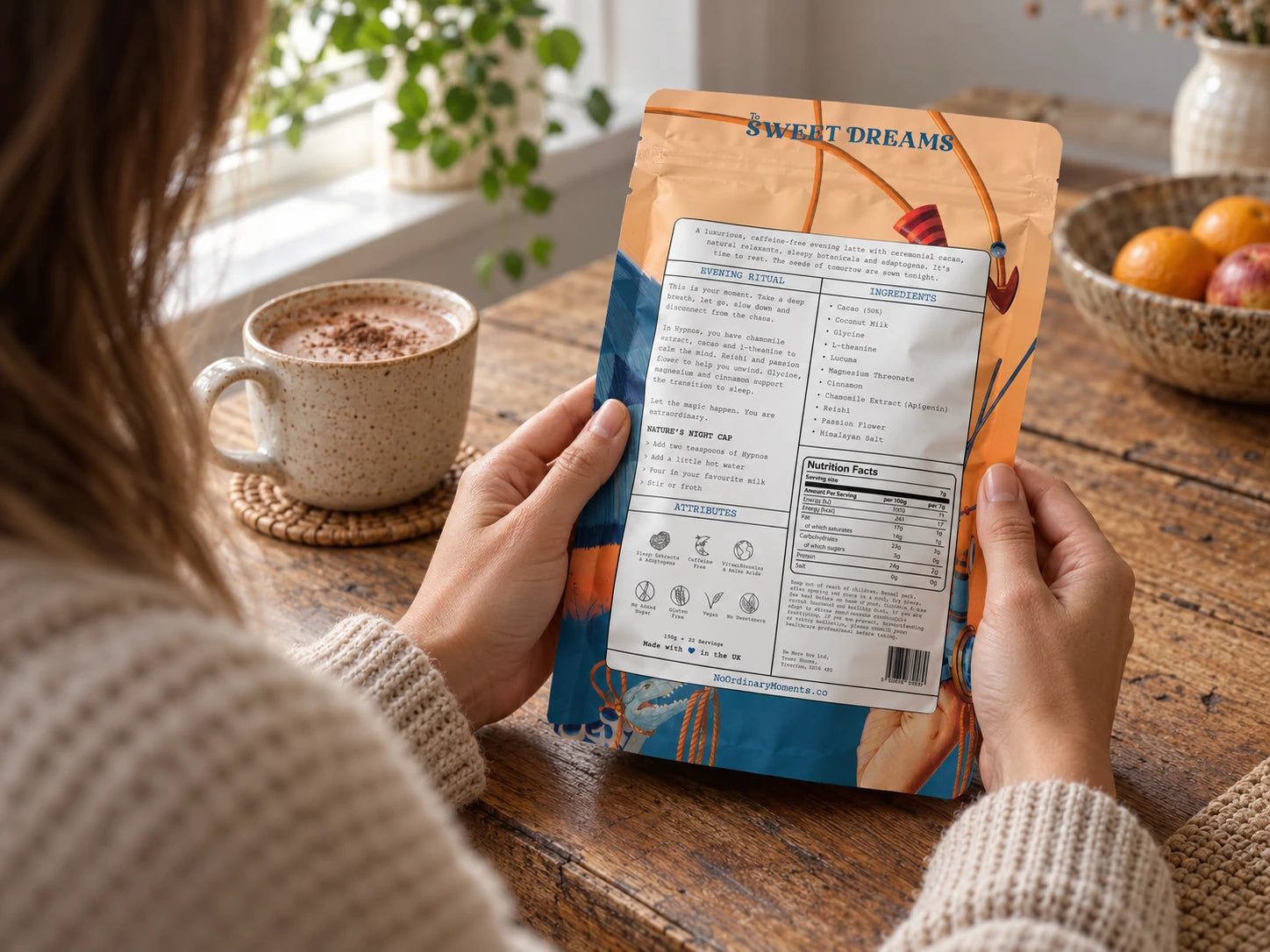 A customer reading the ingredients on the back of a Hypnos SuperLatte pouch beside a warm cacao